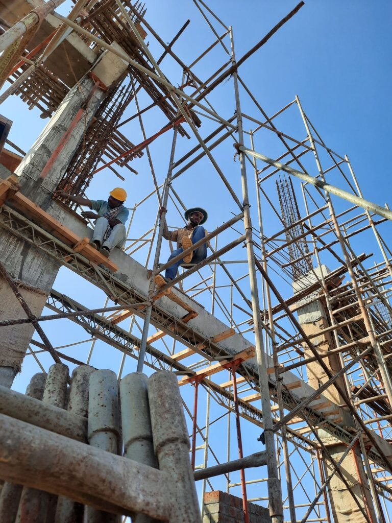 Construction workers collaborating at an active construction site