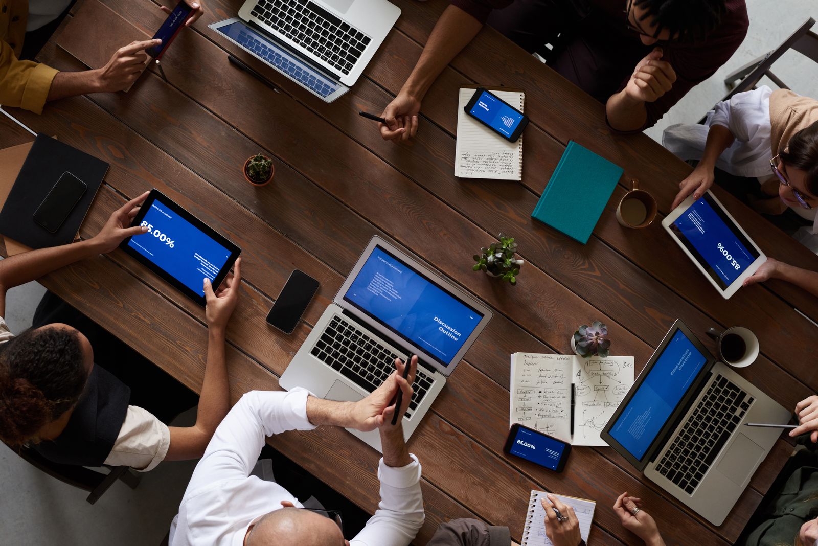 Small team collaborating around a table in a meeting