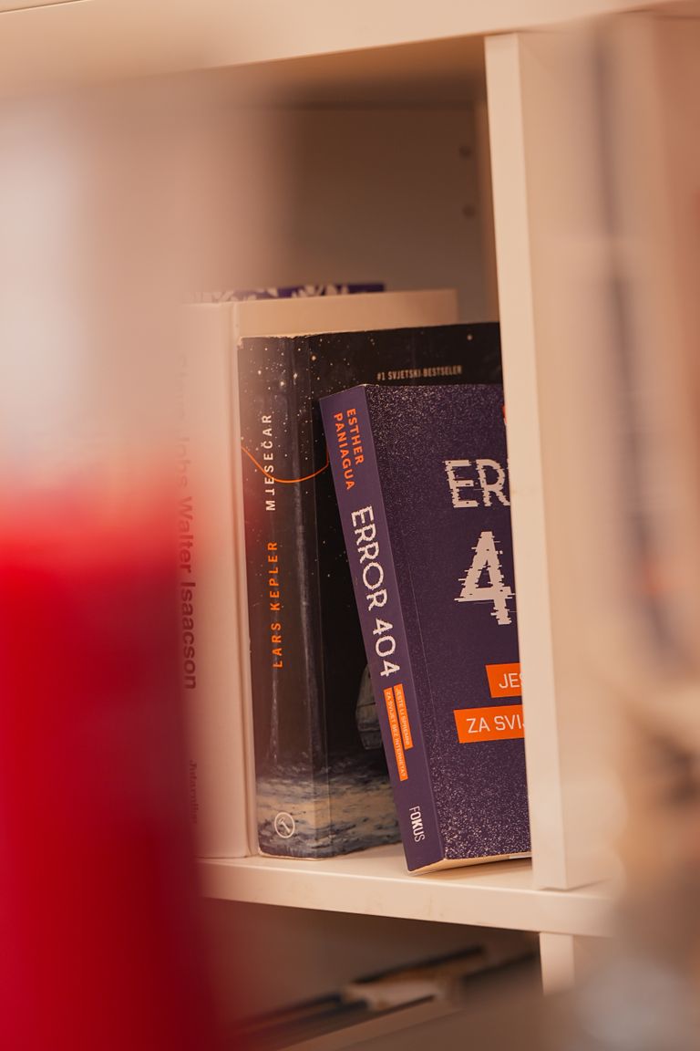 Bookshelf with various books, including one titled 'Error 404'.